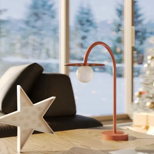 Lampă de masă sculpturală roșie Maxlight Enigma T0059 într-un decor modern.